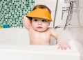 Bbluv Kap Silicone Baby Shampoo Cap, Adjustable Eye and Ear Protection, Orange