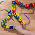 Melissa & Doug Deluxe Wooden Lacing Beads, 27 Beads with 2 Laces