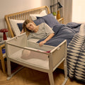 Snuzpod Studio Bedside Crib Oslo Grey with Panoramic Mesh and Castor Wheels